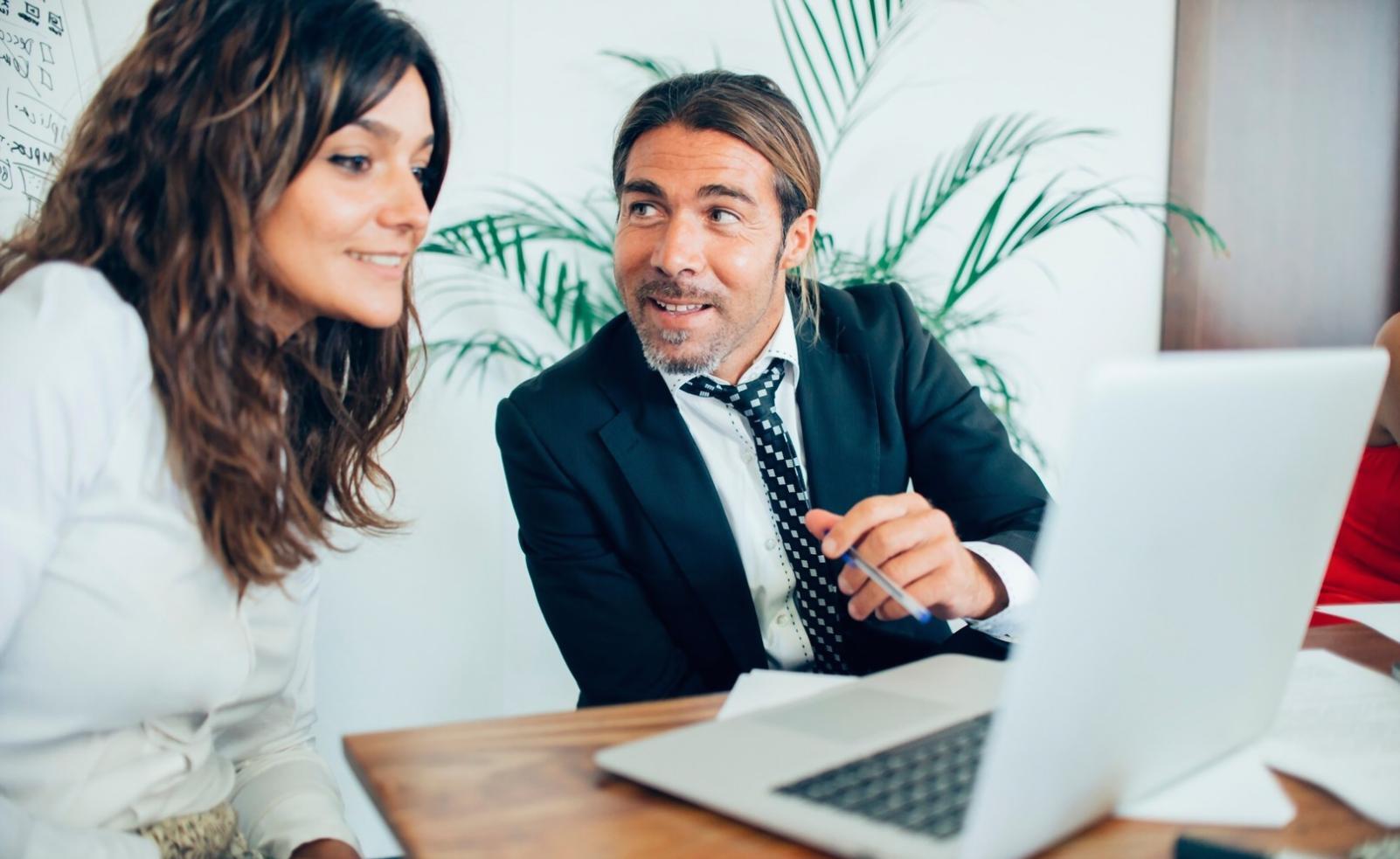 Team member reviewing financial security documentation and fraud prevention resources