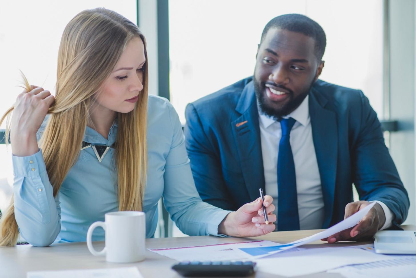 Students working together on fraud case analysis during workshop session